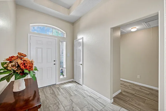 a view of entryway with wooden floor