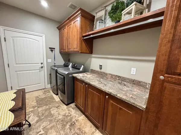 a kitchen with a stove and a refrigerator
