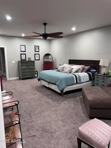a spacious bedroom with two beds and a couch