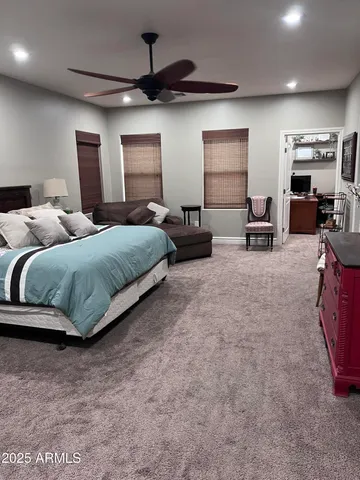 a bedroom with bed and window