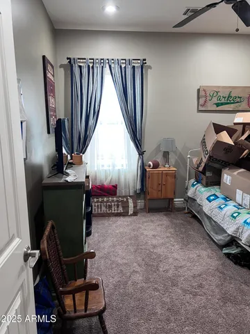 a bedroom with furniture and a window