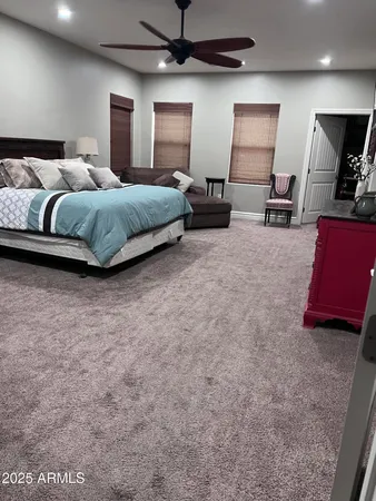 a bedroom with a bed and furniture