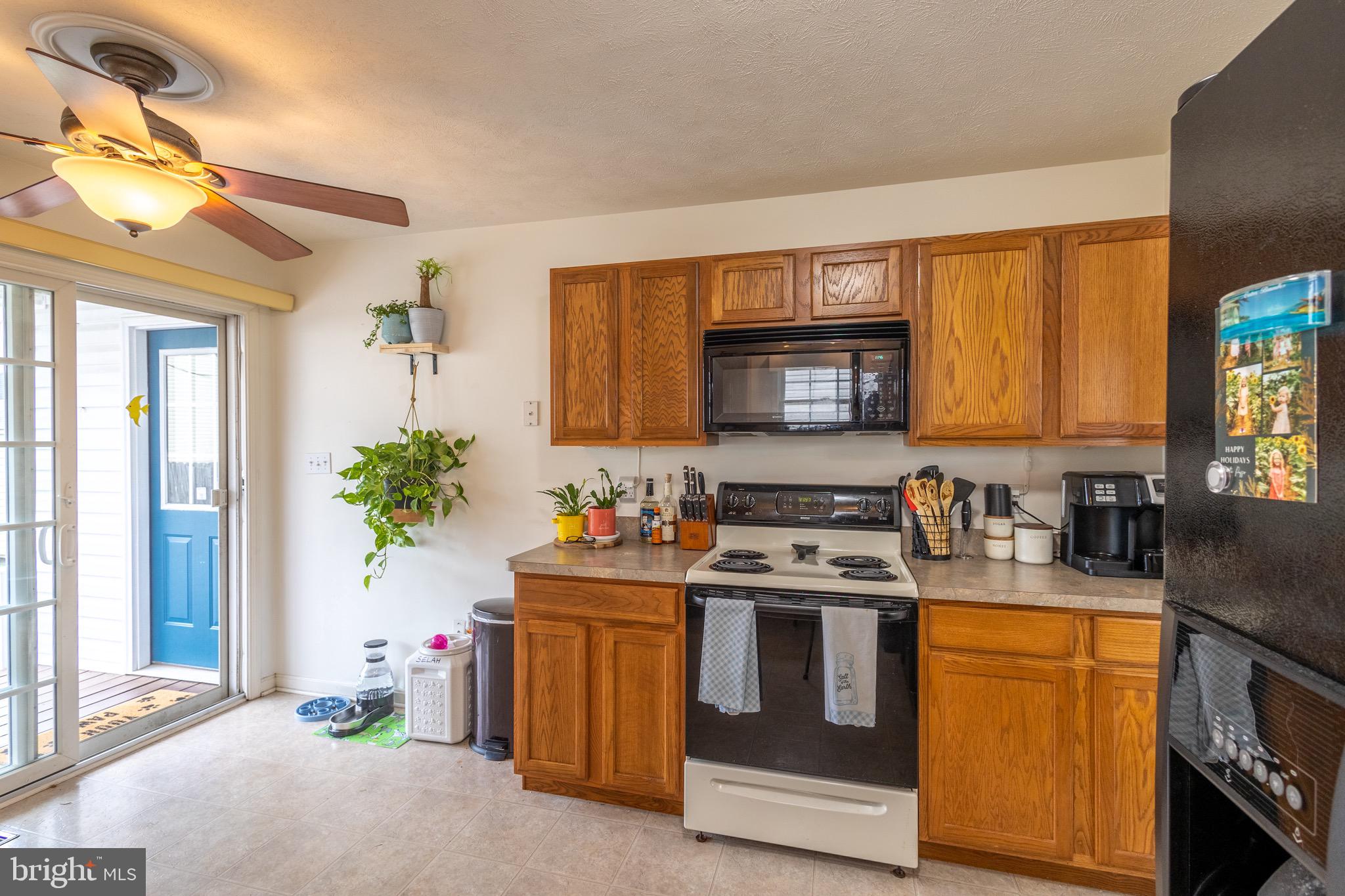 336 4th Street Colonial Beach, VA 22443 - Photo 12 of 23 a kitchen with a sink stove and microwave