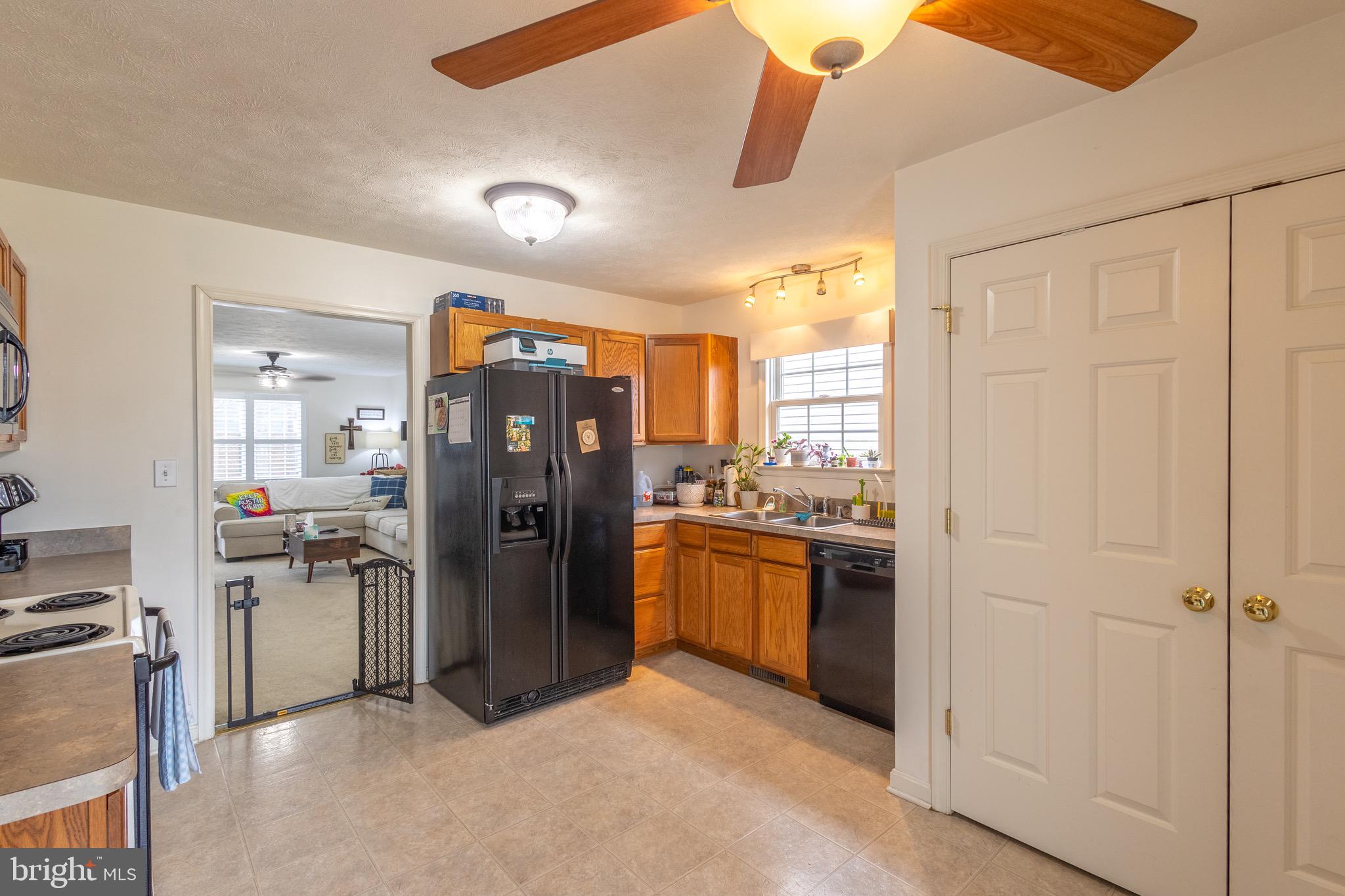 336 4th Street Colonial Beach, VA 22443 - Photo 13 of 23 a kitchen with stainless steel appliances granite countertop a refrigerator and a stove