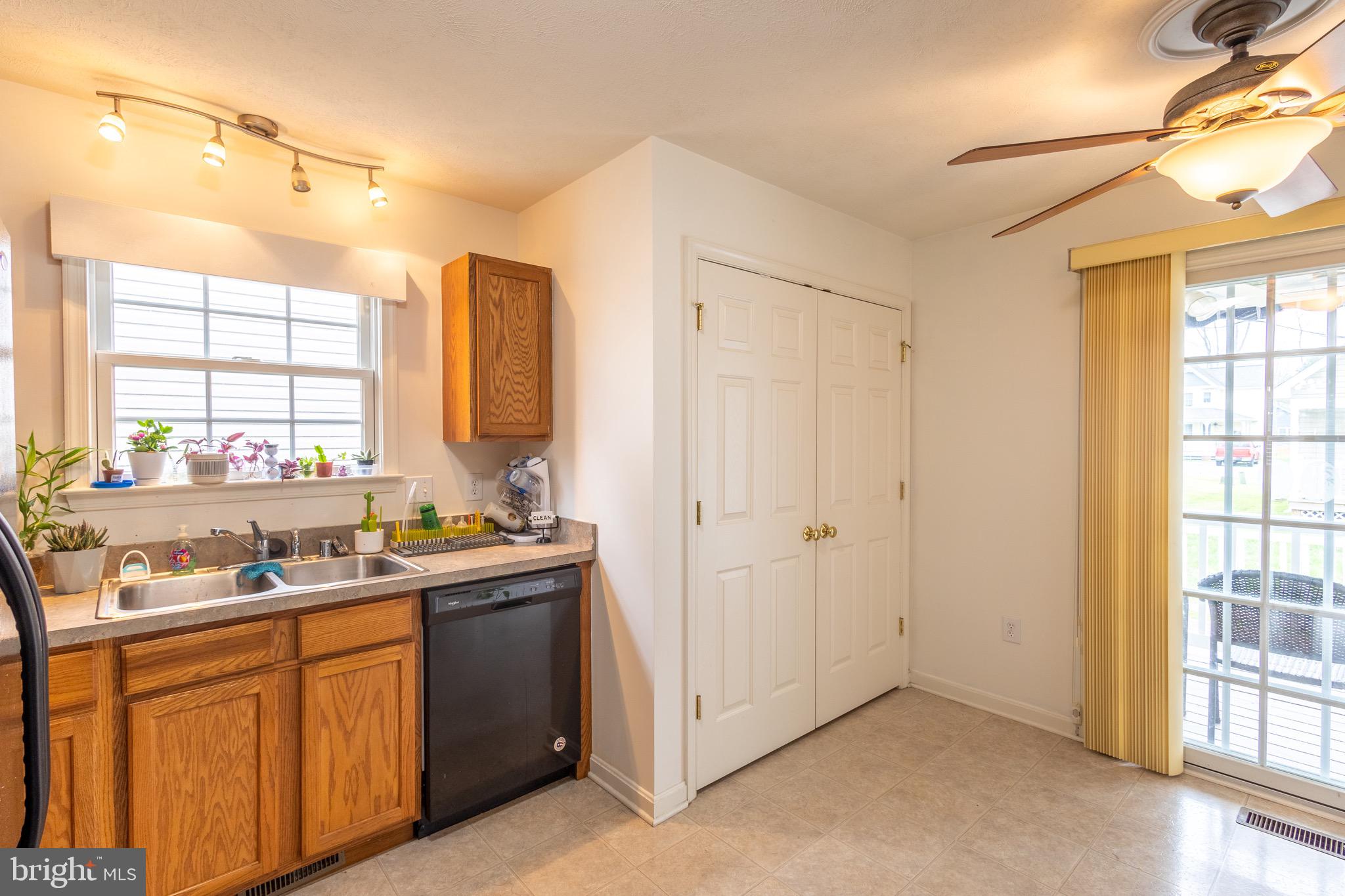 336 4th Street Colonial Beach, VA 22443 - Photo 14 of 23 a kitchen with a sink stove and cabinets