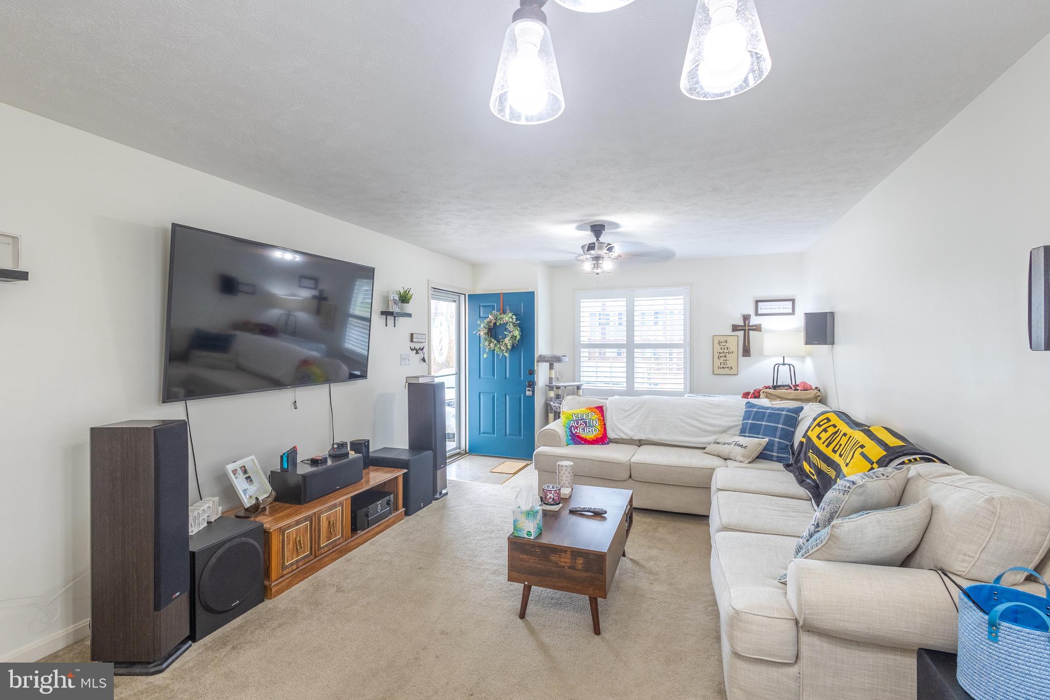 336 4th Street Colonial Beach, VA 22443 - Photo 15 of 23 a living room with furniture and a flat screen tv