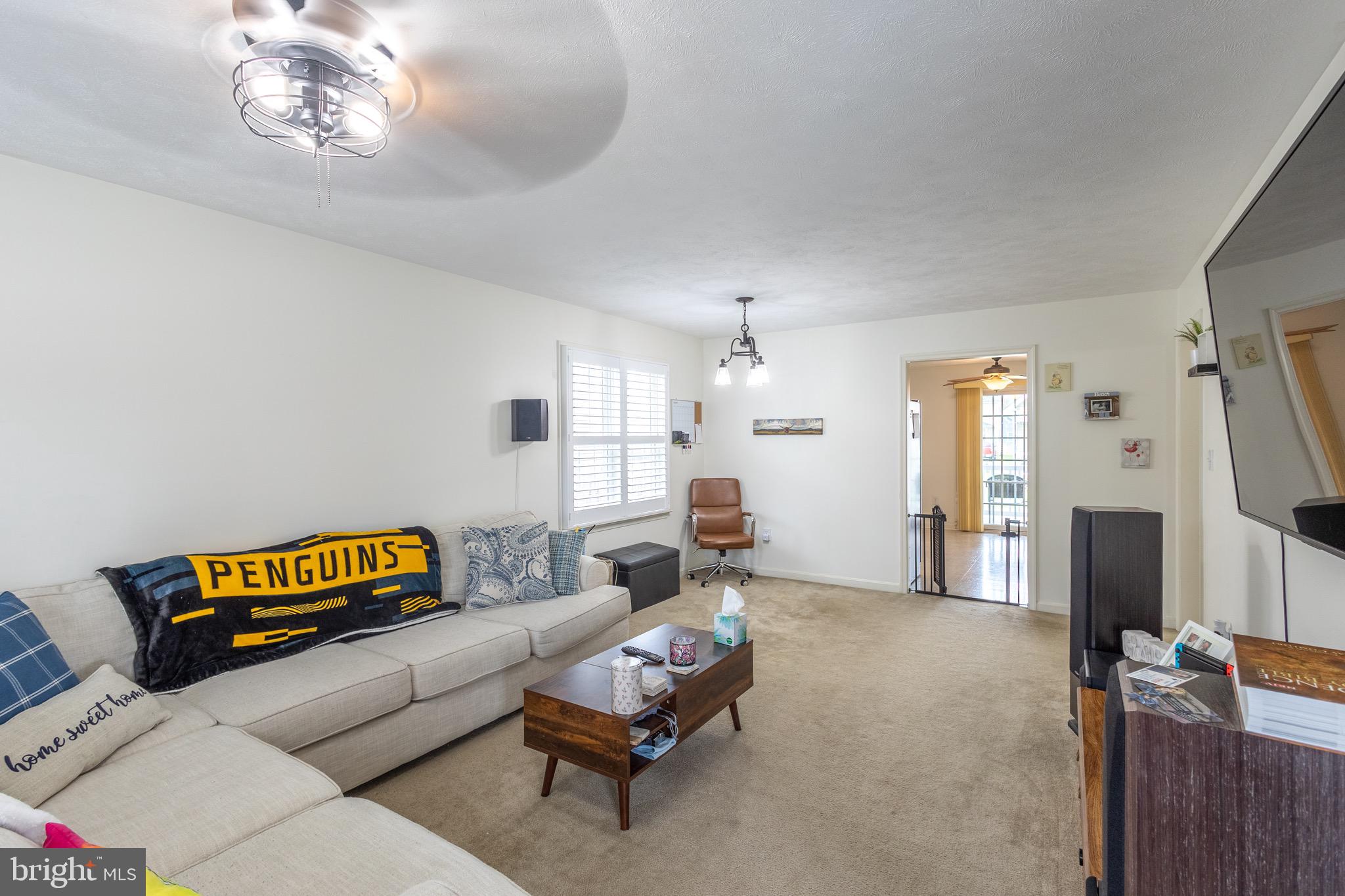 336 4th Street Colonial Beach, VA 22443 - Photo 16 of 23 a living room with furniture and a flat screen tv
