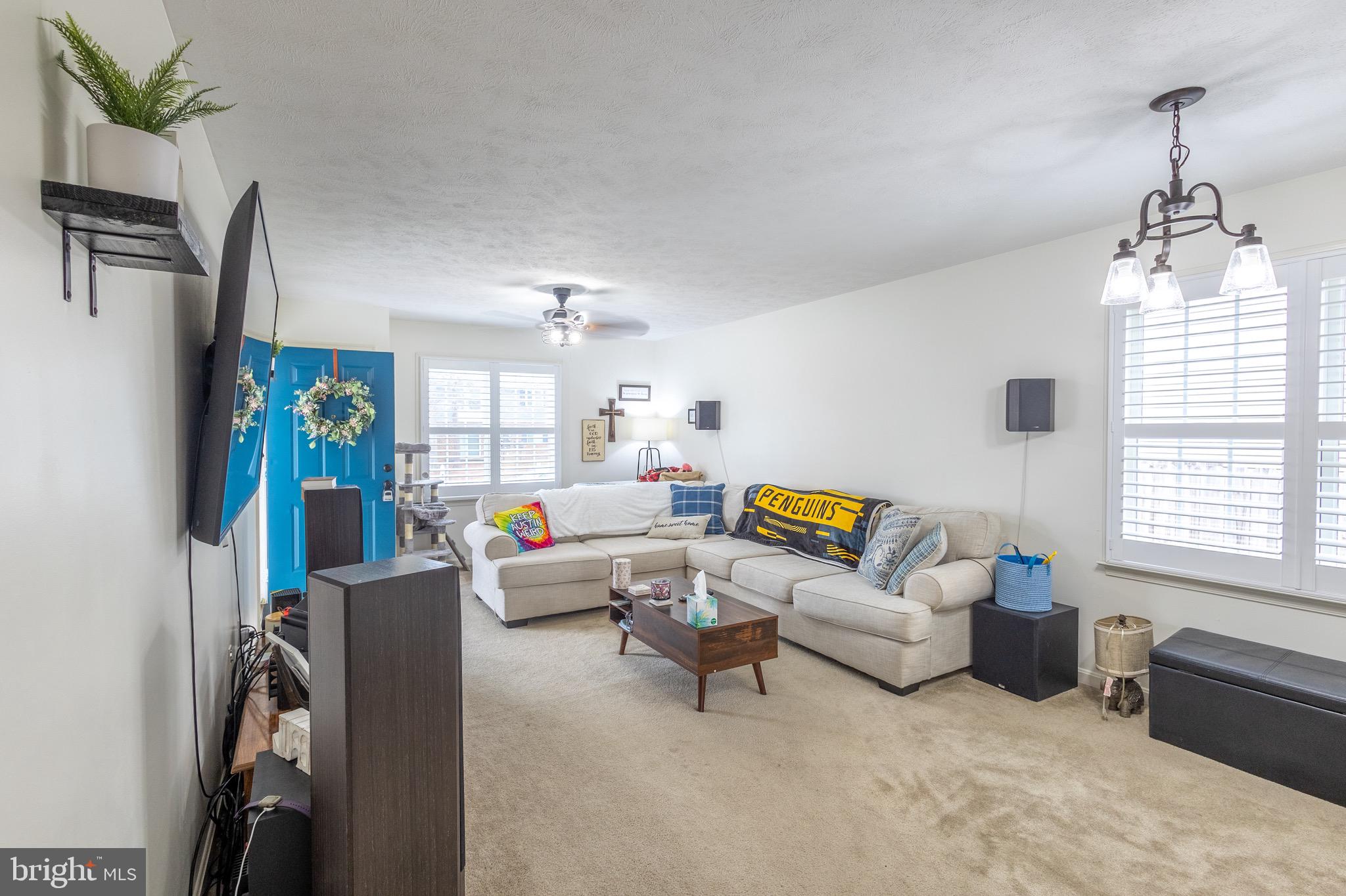 336 4th Street Colonial Beach, VA 22443 - Photo 17 of 23 a living room with furniture a flat screen tv and a window