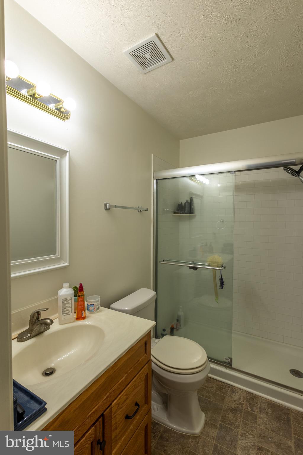 336 4th Street Colonial Beach, VA 22443 - Photo 19 of 23 a bathroom with a sink toilet and shower