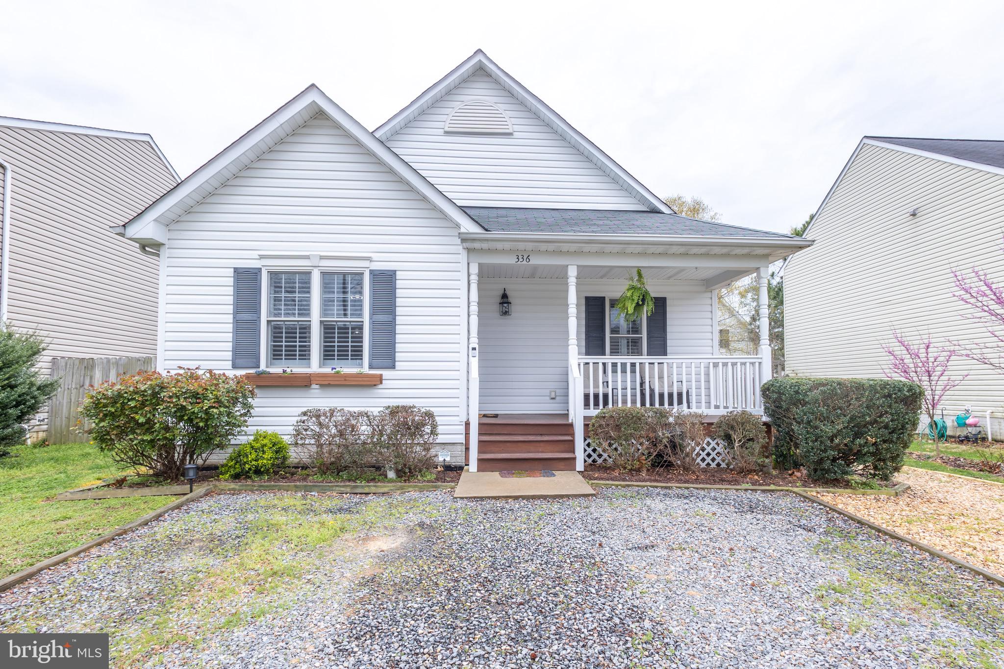 336 4th Street Colonial Beach, VA 22443 - Photo 2 of 23 a front view of a house with garden
