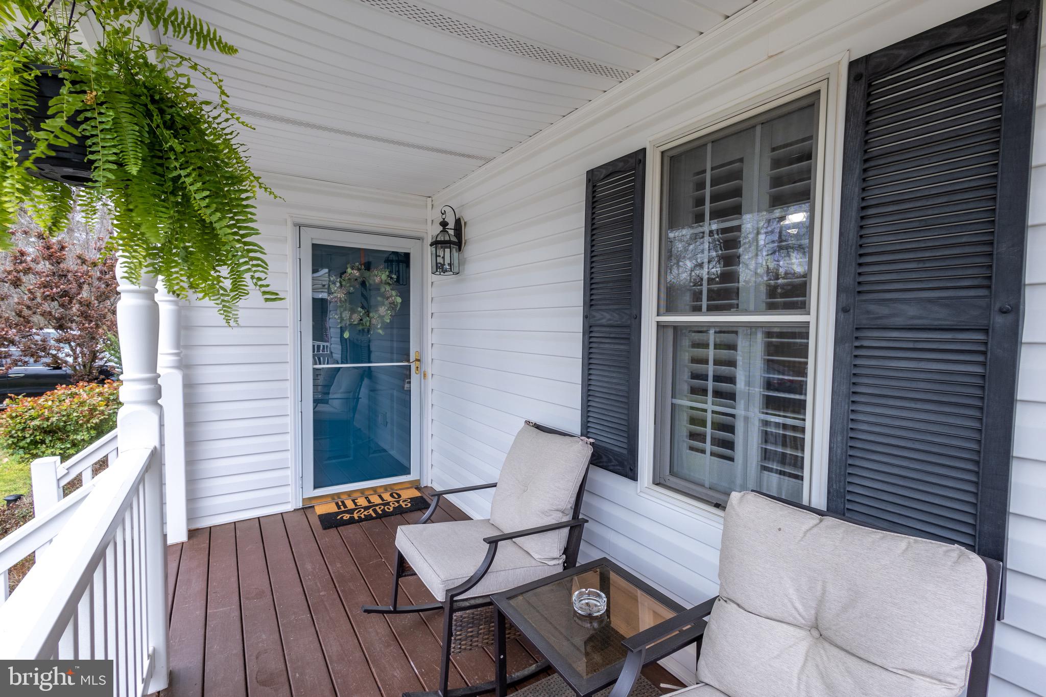 336 4th Street Colonial Beach, VA 22443 - Photo 3 of 23 a view of a chair and table in the balcony