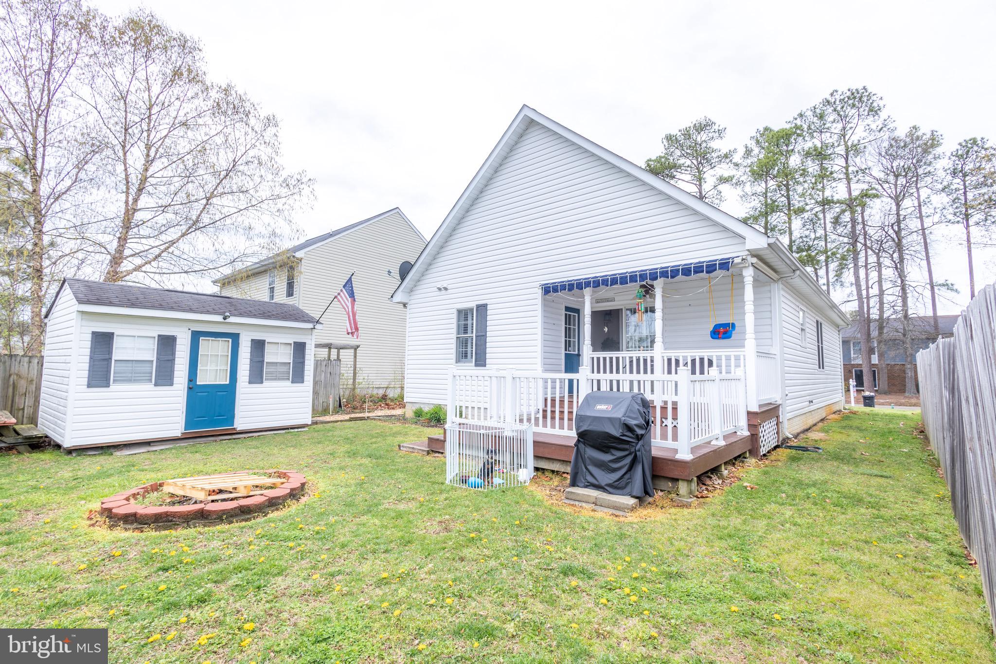 336 4th Street Colonial Beach, VA 22443 - Photo 10 of 23 a view of a house with a yard and sitting area