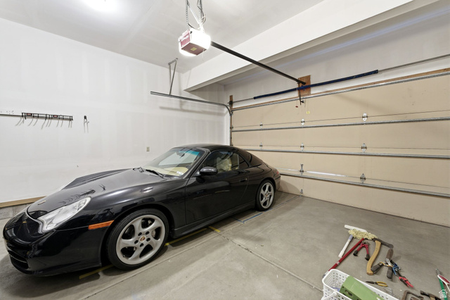 7235 Viansa Court Midvale, UT 84047 - Photo 38 of 43 Garage featuring a garage door opener