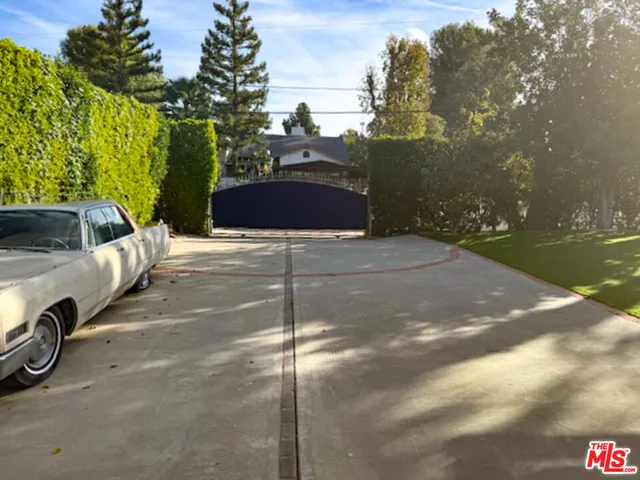 a view of a car in front of a house
