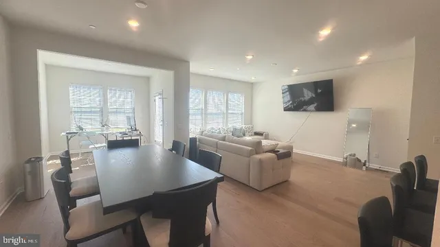 a living room with fireplace furniture and a flat screen tv