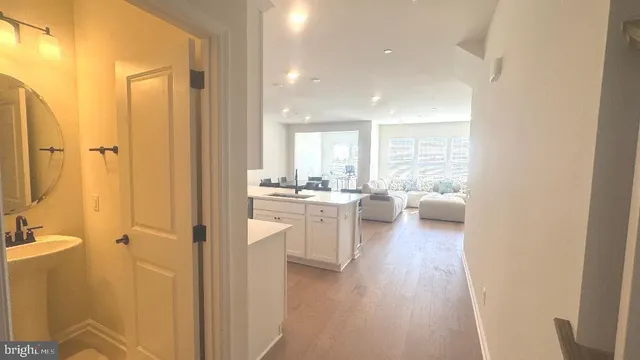 a kitchen with a refrigerator and a sink