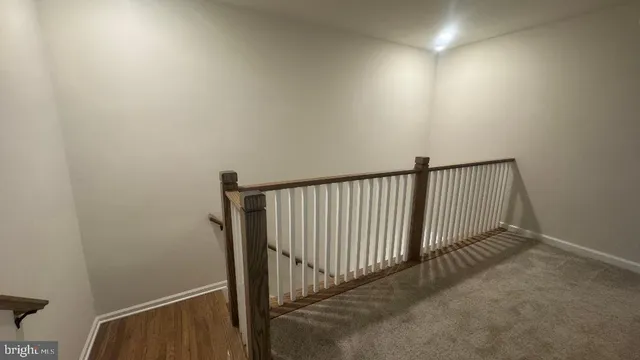 a view of a room with rack and wooden floor