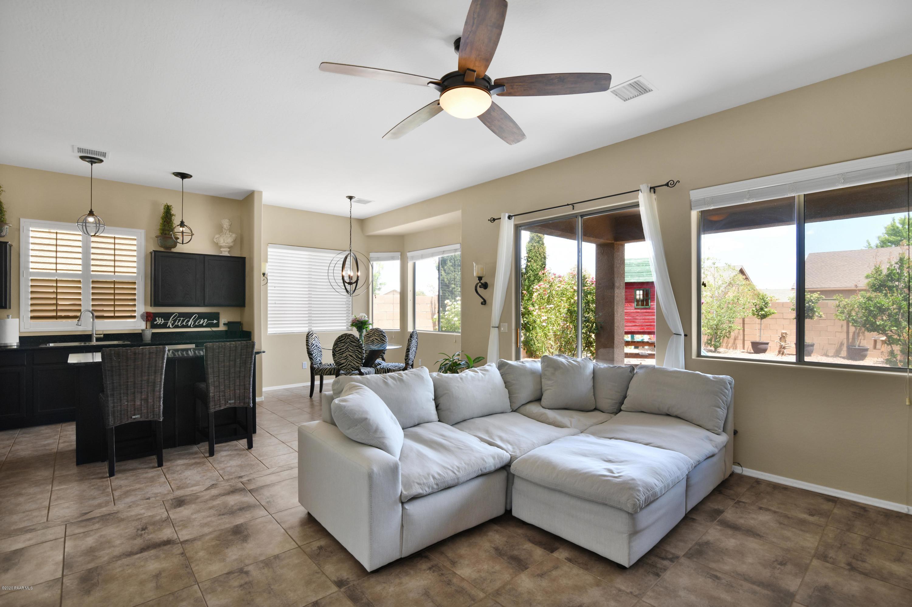 4825 Edgemont Road Prescott Valley, AZ 86314 - Photo 15 of 34 a living room with furniture and a large window