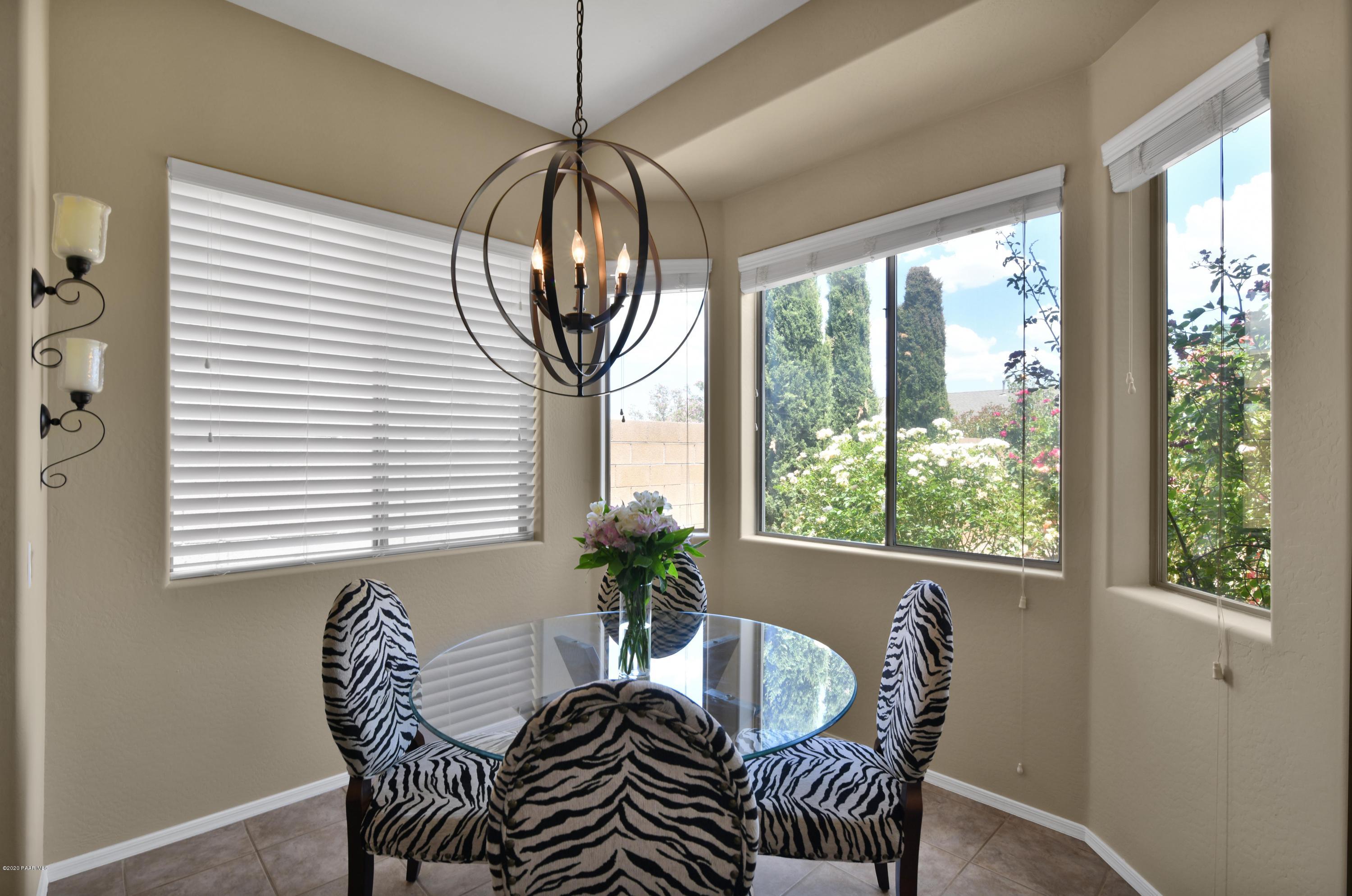 4825 Edgemont Road Prescott Valley, AZ 86314 - Photo 16 of 34 a view of a dining room with furniture window and outside view