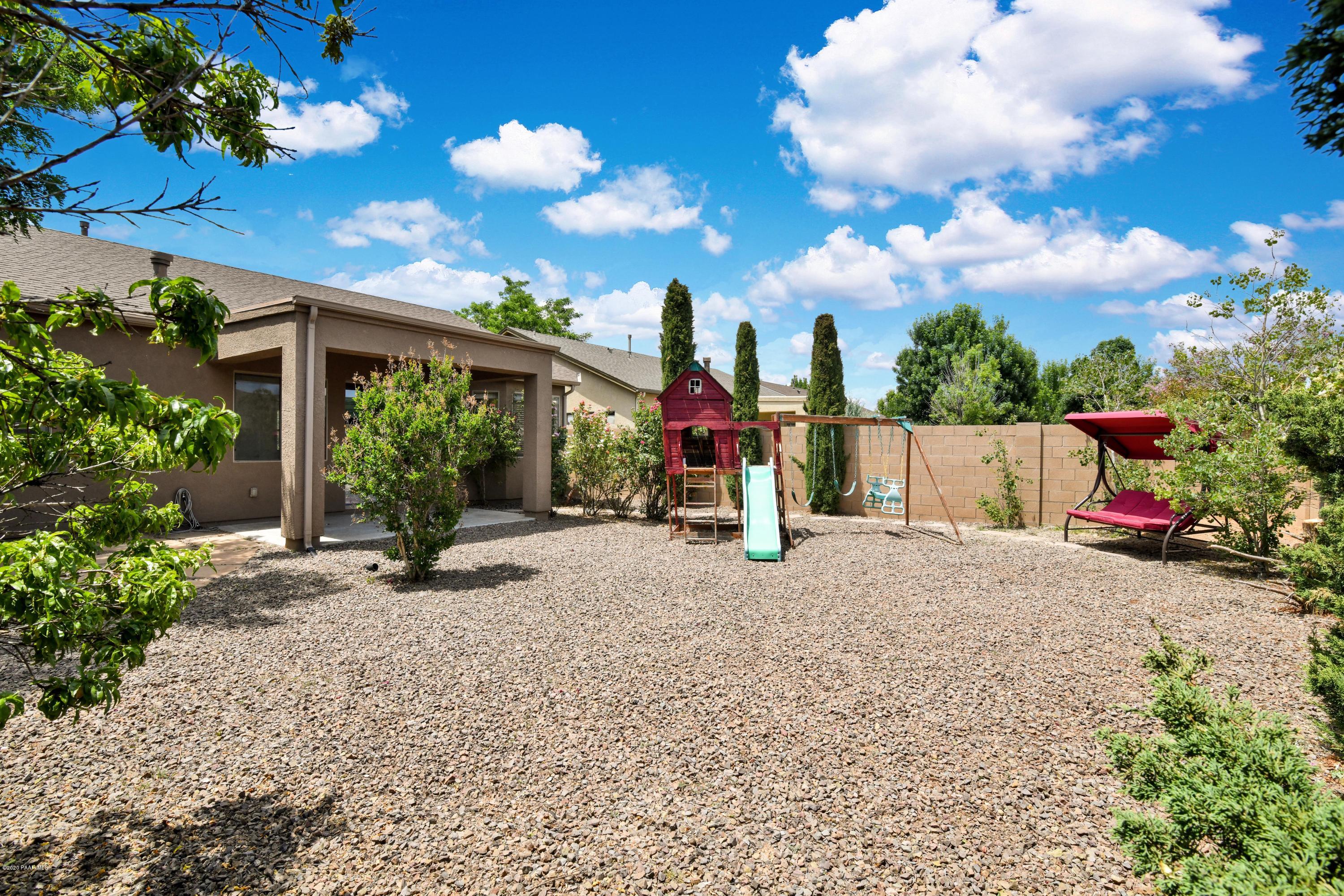 4825 Edgemont Road Prescott Valley, AZ 86314 - Photo 33 of 34 a view of a house with backyard and garden