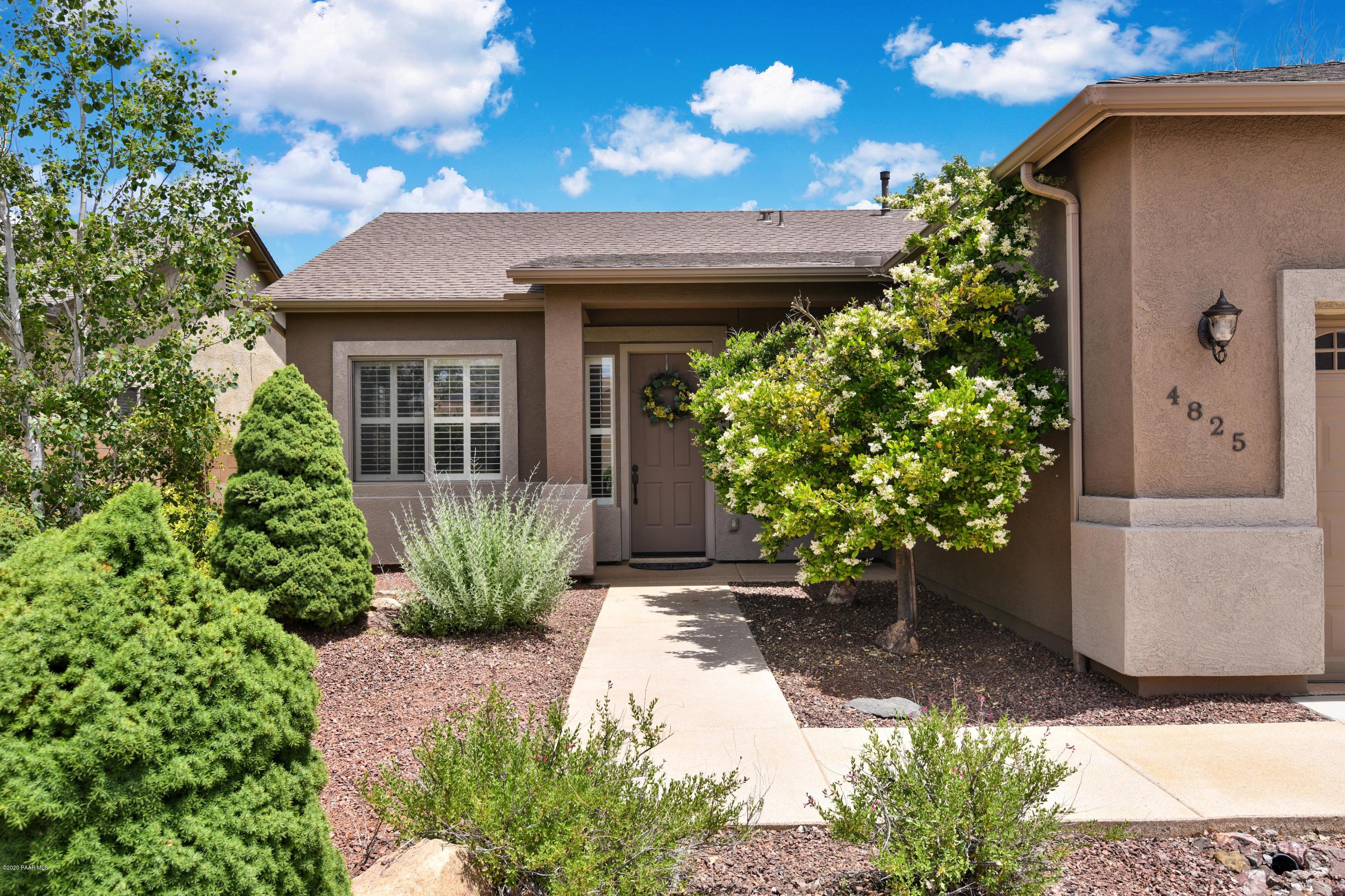4825 Edgemont Road Prescott Valley, AZ 86314 - Photo 8 of 34 a front view of a house with garden