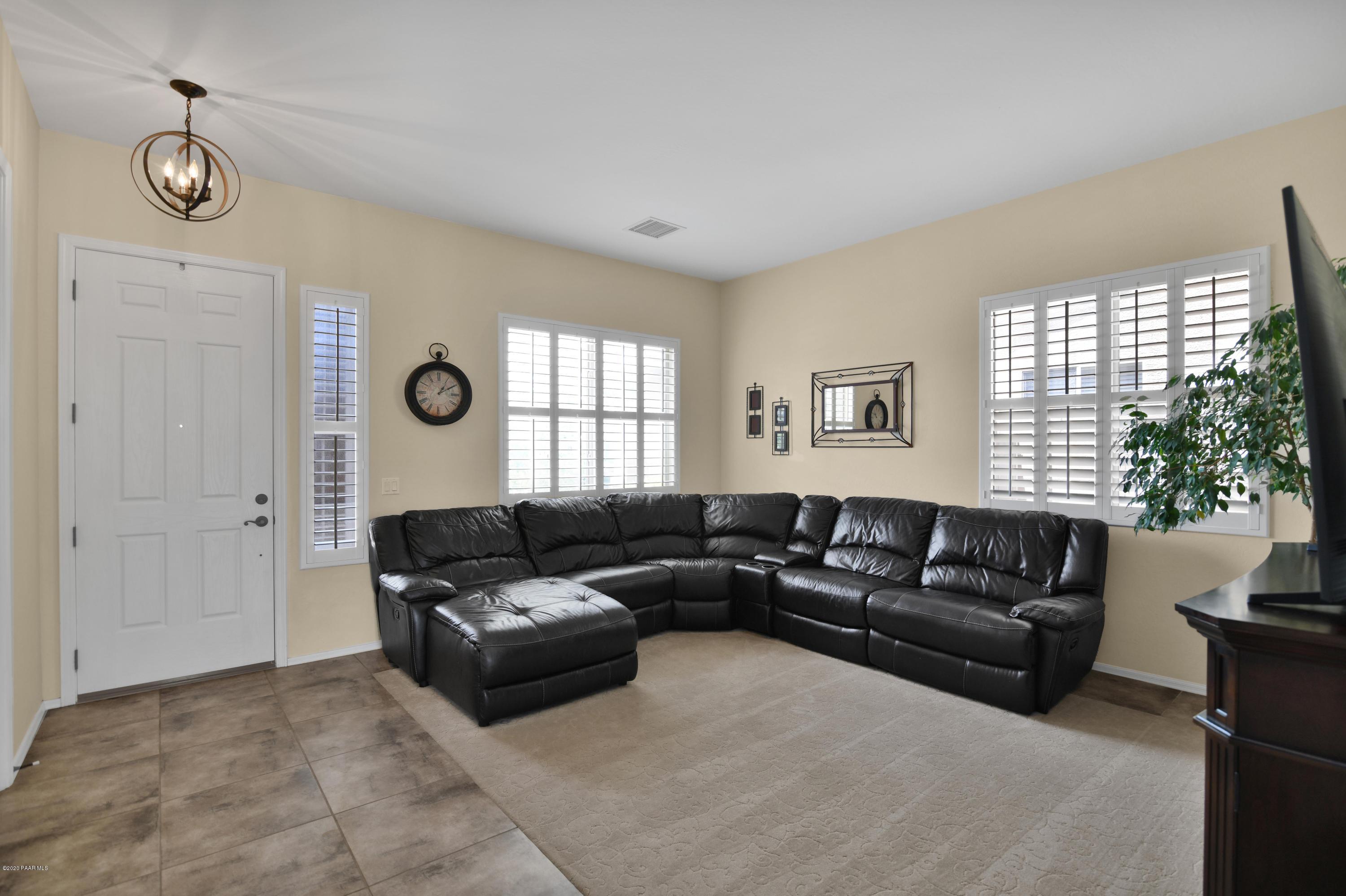 4825 Edgemont Road Prescott Valley, AZ 86314 - Photo 9 of 34 a living room with furniture and a window