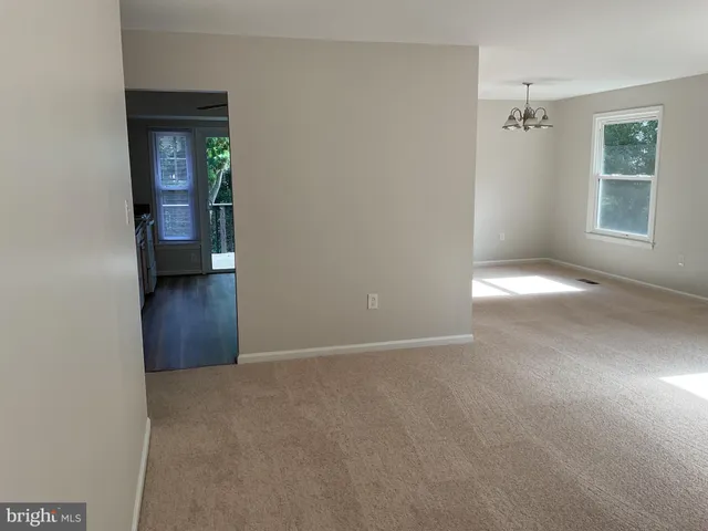 a kitchen with stainless steel appliances granite countertop a refrigerator sink and stove