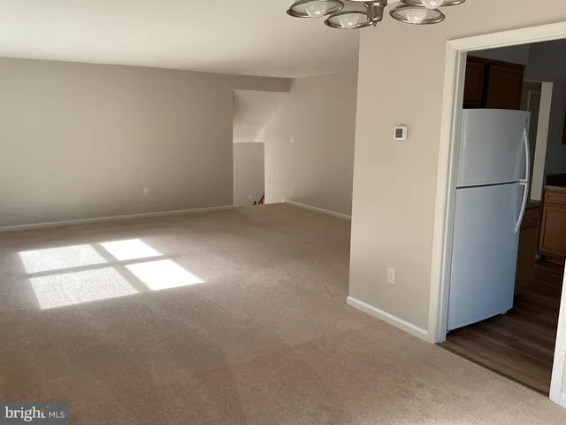a bathroom with a sink and mirror with toilet