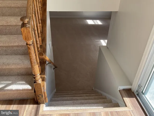 an empty room with a painting on the wall