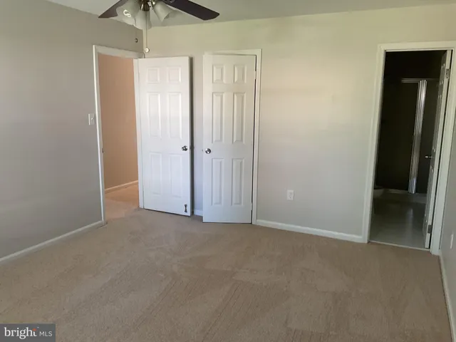 an empty room with closet area
