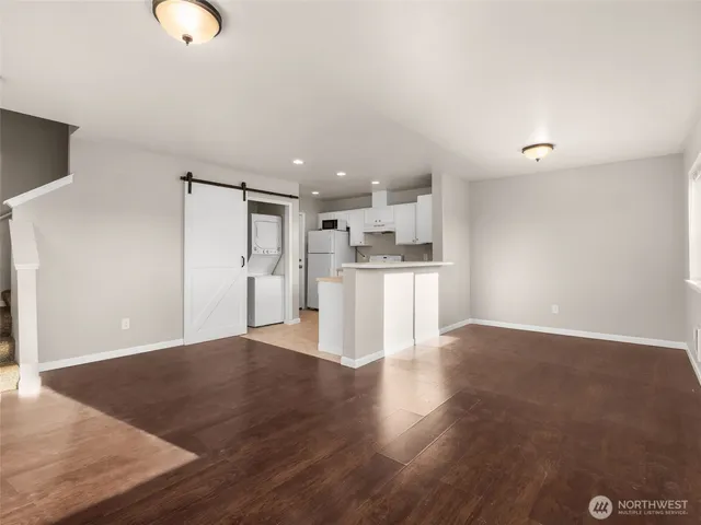 a view of a kitchen with wooden floor