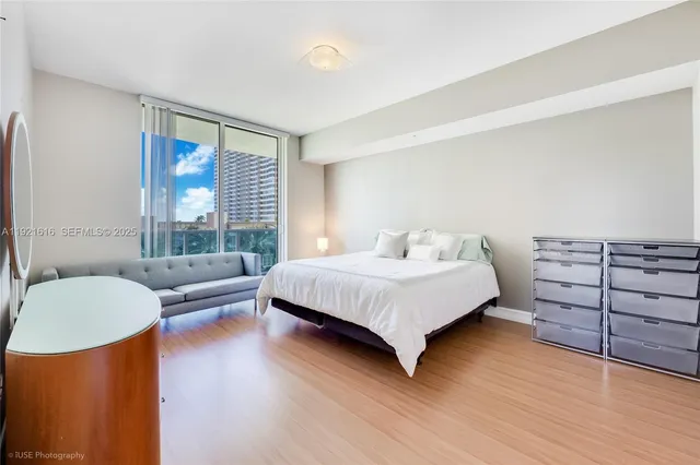 a bedroom with a bed and a couch