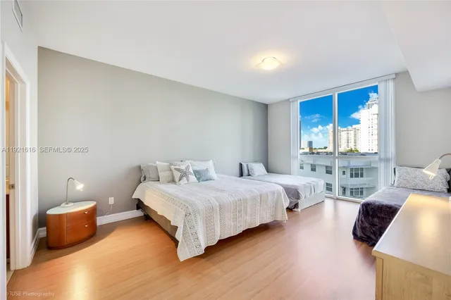 a bedroom with a bed and a couch