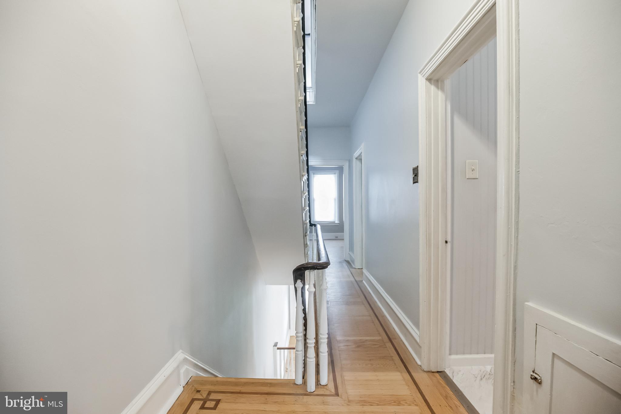 117 Rochelle Avenue Philadelphia, PA 19128 - Photo 17 of 29 a view of a hallway with wooden floor and staircase