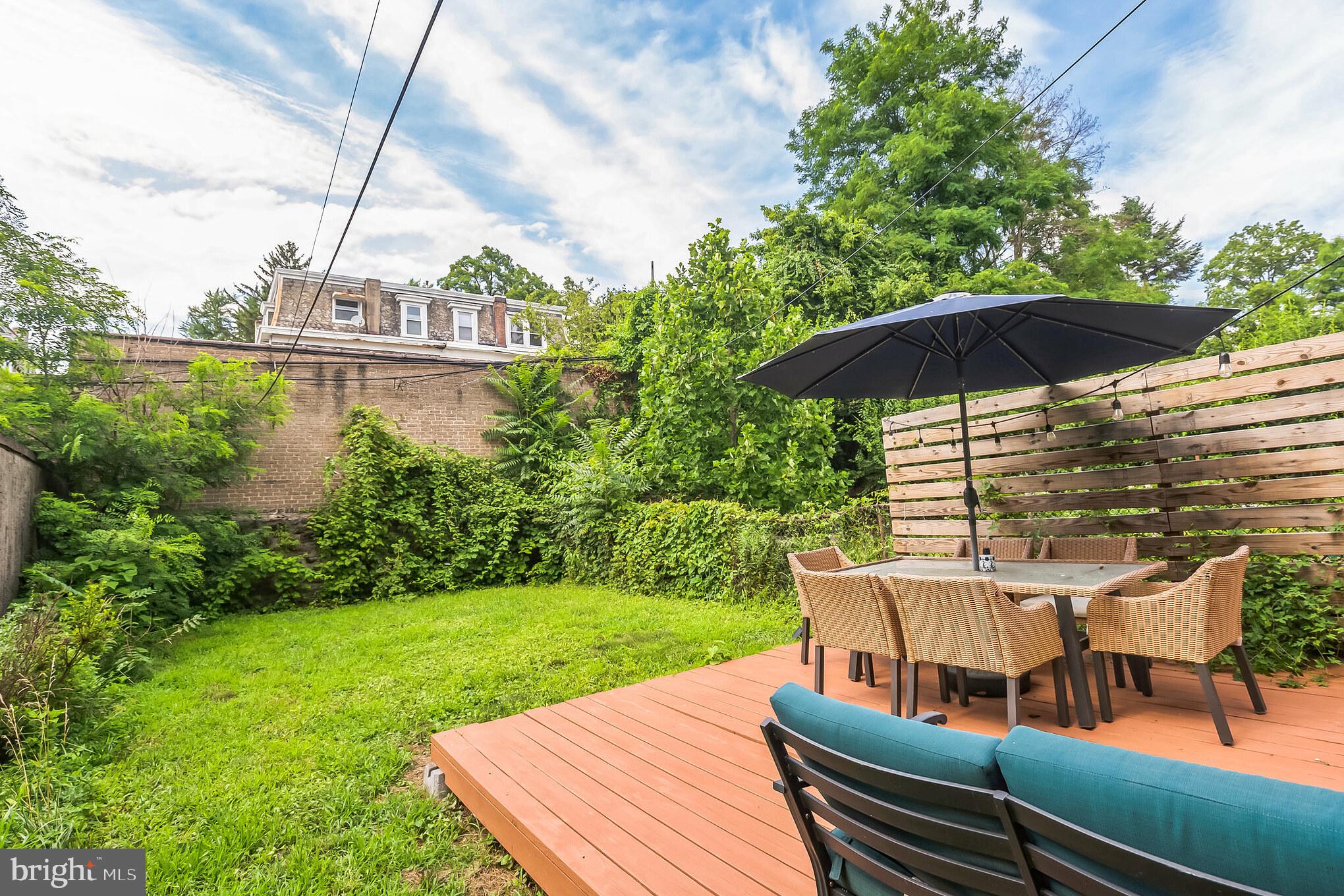 117 Rochelle Avenue Philadelphia, PA 19128 - Photo 24 of 29 a view of a deck with furniture and a garden