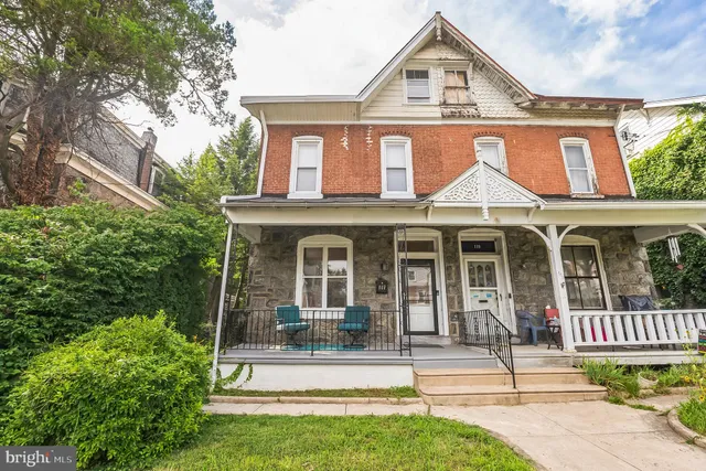 a front view of a house with a porch