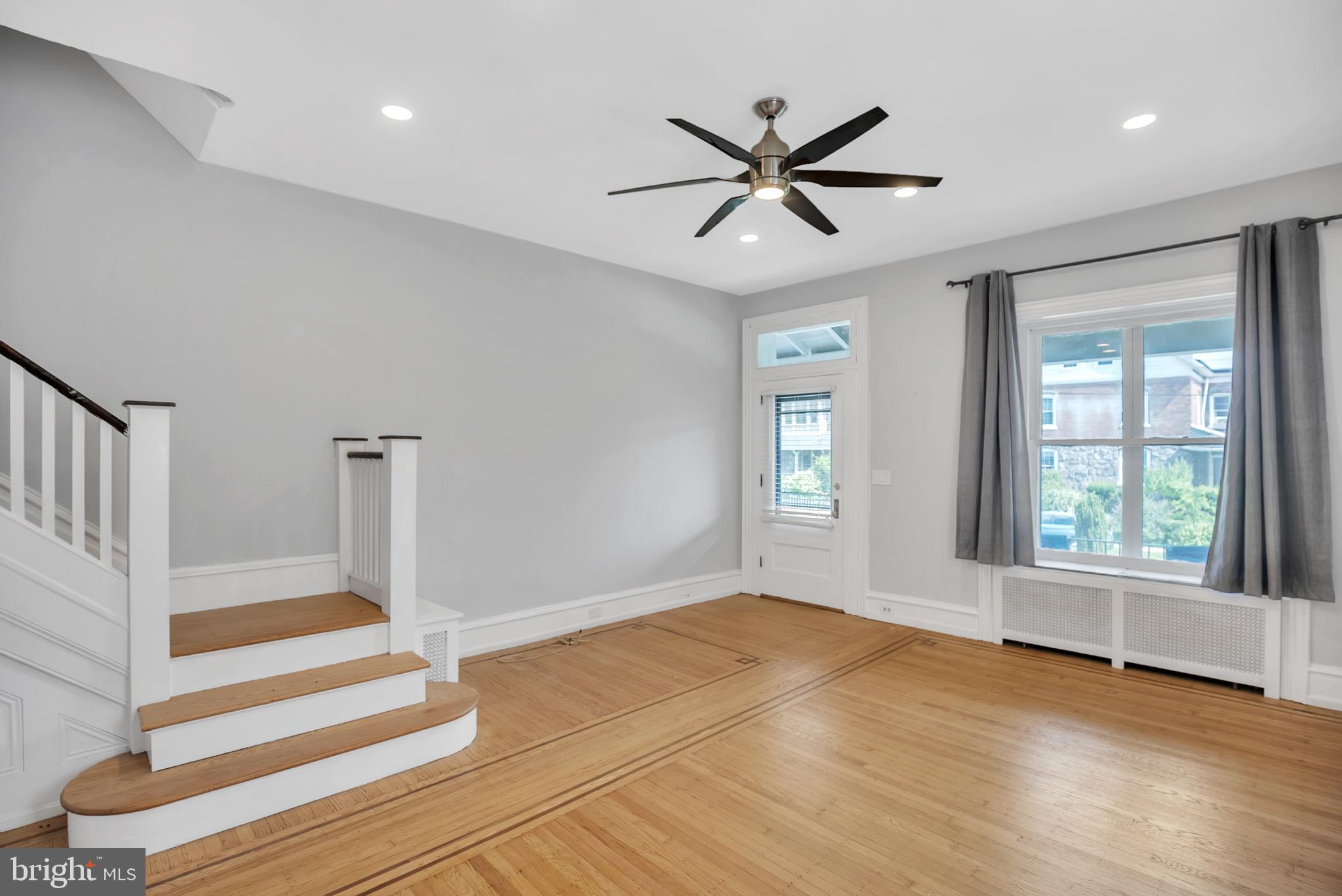 117 Rochelle Avenue Philadelphia, PA 19128 - Photo 4 of 29 a view of an empty room with wooden floor and a window