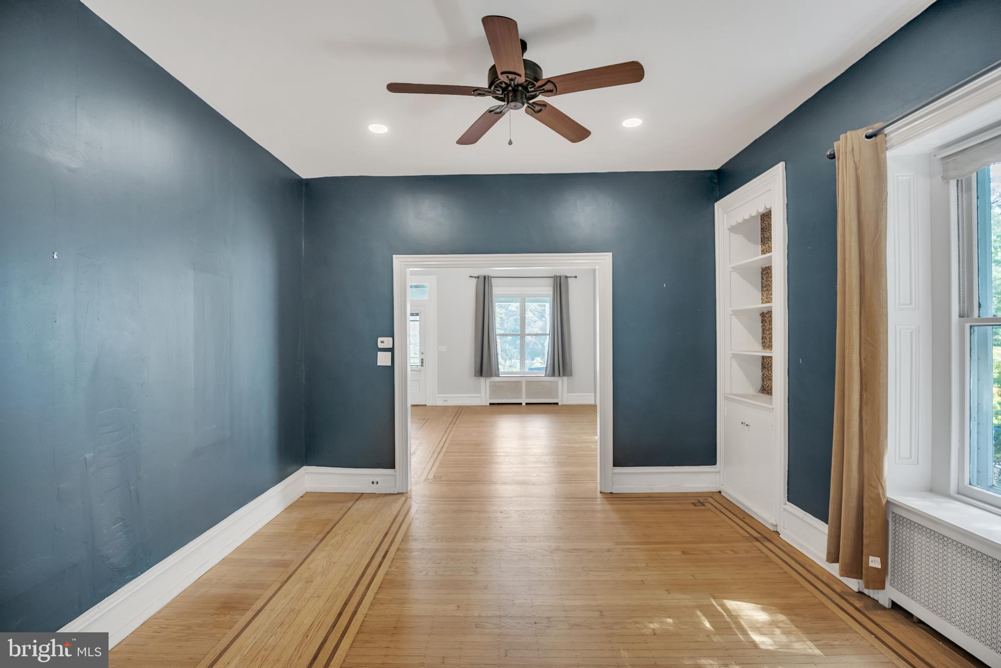 117 Rochelle Avenue Philadelphia, PA 19128 - Photo 7 of 29 a view of a hallway with a chandelier fan and windows