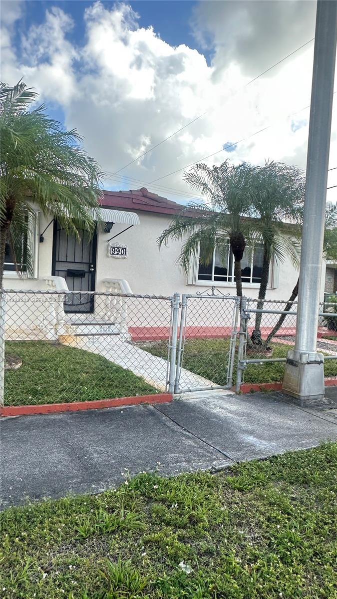 990 East 2nd Street, Unit B Hialeah, FL 33010 - Photo 2 of 12 a view of a house with backyard and bushes
