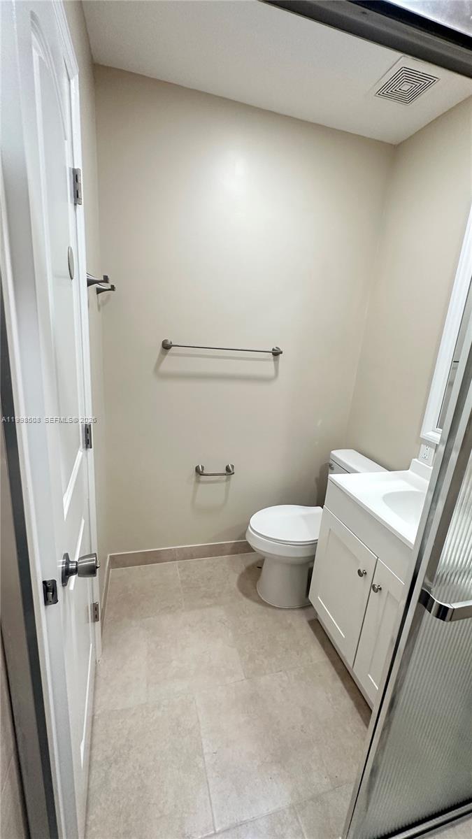 990 East 2nd Street, Unit B Hialeah, FL 33010 - Photo 9 of 12 a bathroom with a sink and toilet