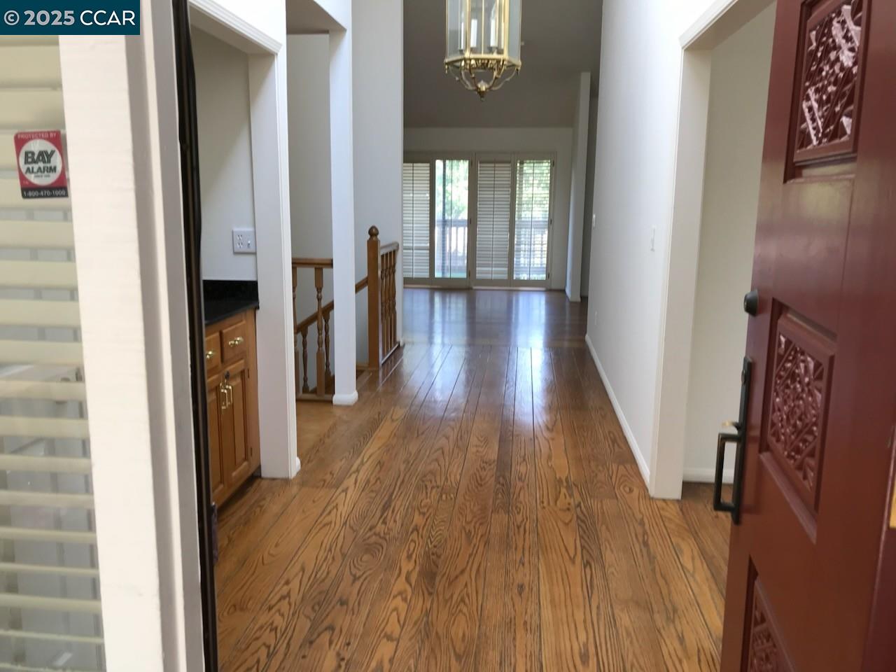 20 Tamarisk Moraga, CA 94556 - Photo 2 of 18 a view of a hallway with wooden floor and staircase