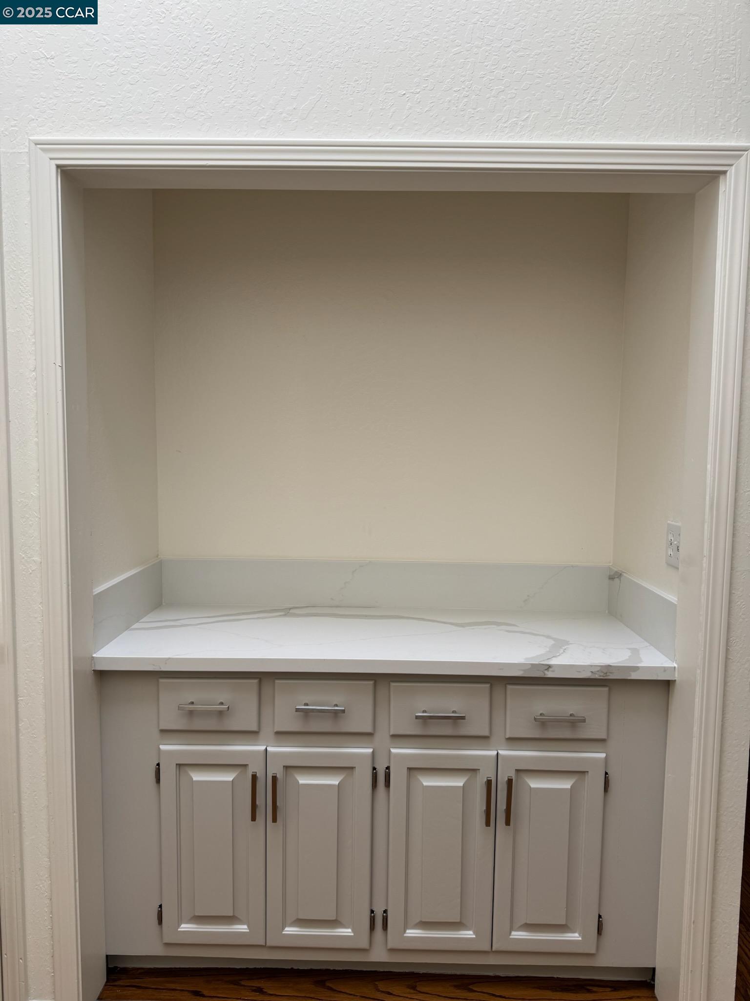 20 Tamarisk Moraga, CA 94556 - Photo 3 of 18 a view of kitchen with white cabinets and a wooden floor