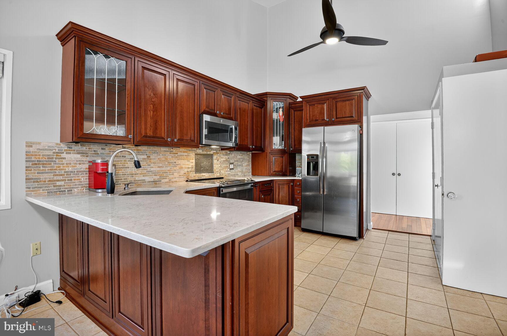 3204 Fox Mill Road Oakton, VA 22124 - Photo 11 of 25 Wood Cabinets, Gleaming white countertop + pantry