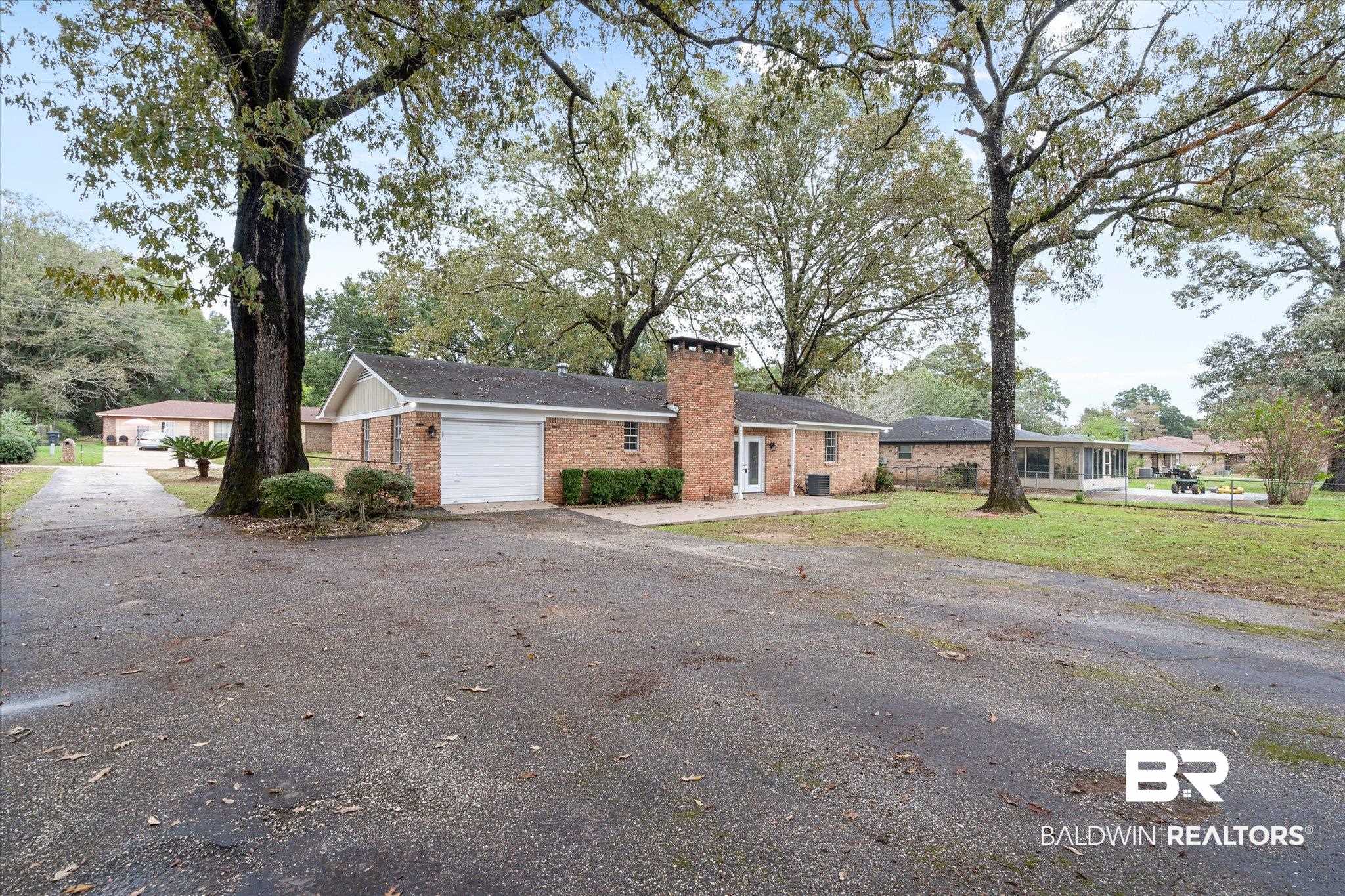 5015 Golfway Drive Eight Mile, AL 36613 - Photo 27 of 31 Ranch-style house with a garage
