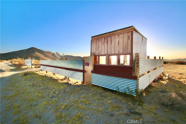 a view of wooden fence and a yard