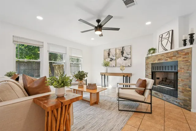 a living room with furniture and a fireplace