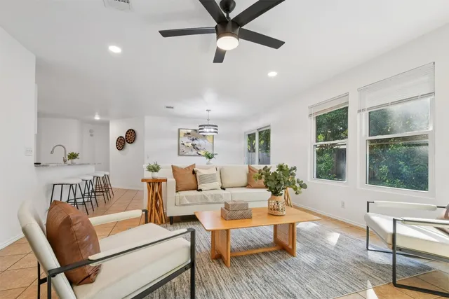 a living room with furniture and a window