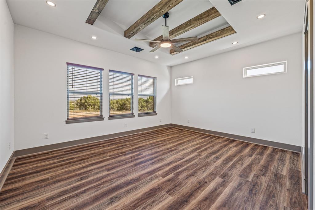1035 Barton Ranch Road Nemo, TX 76070 - Photo 19 of 28 Unfurnished room featuring beamed ceiling, dark wood finished floors, recessed lighting, and ceiling fan