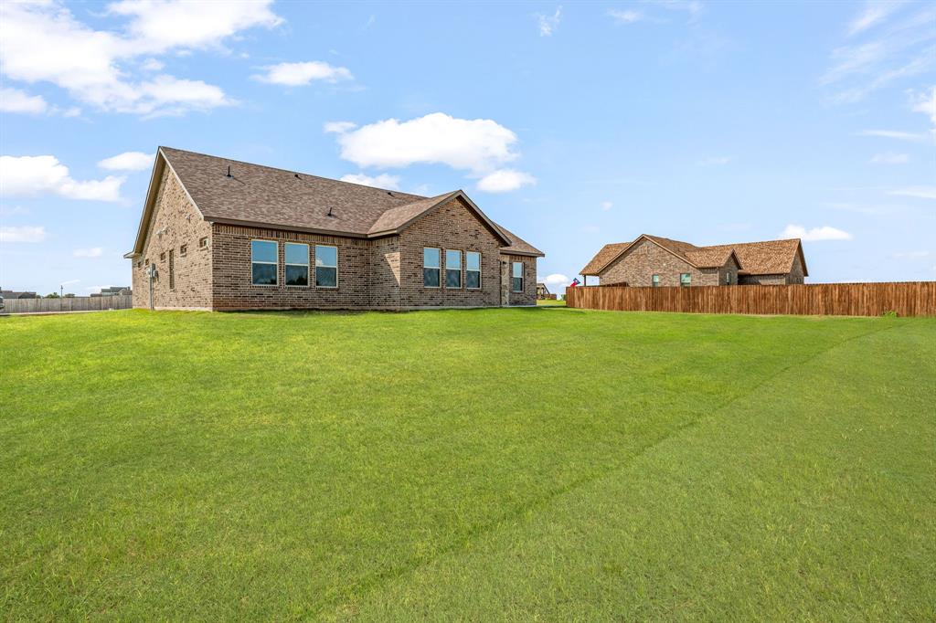 1035 Barton Ranch Road Nemo, TX 76070 - Photo 25 of 28 Rear view of house featuring brick siding and roof with shingles