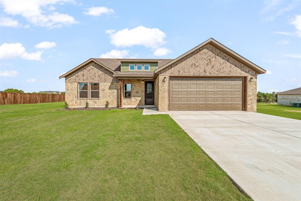 1035 Barton Ranch Road Nemo, TX 76070 - Photo 3 of 28 View of front facade featuring driveway, a shingled roof, covered porch, a garage, and brick siding